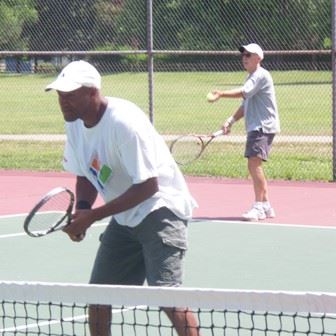 Two People Playing Tennis
