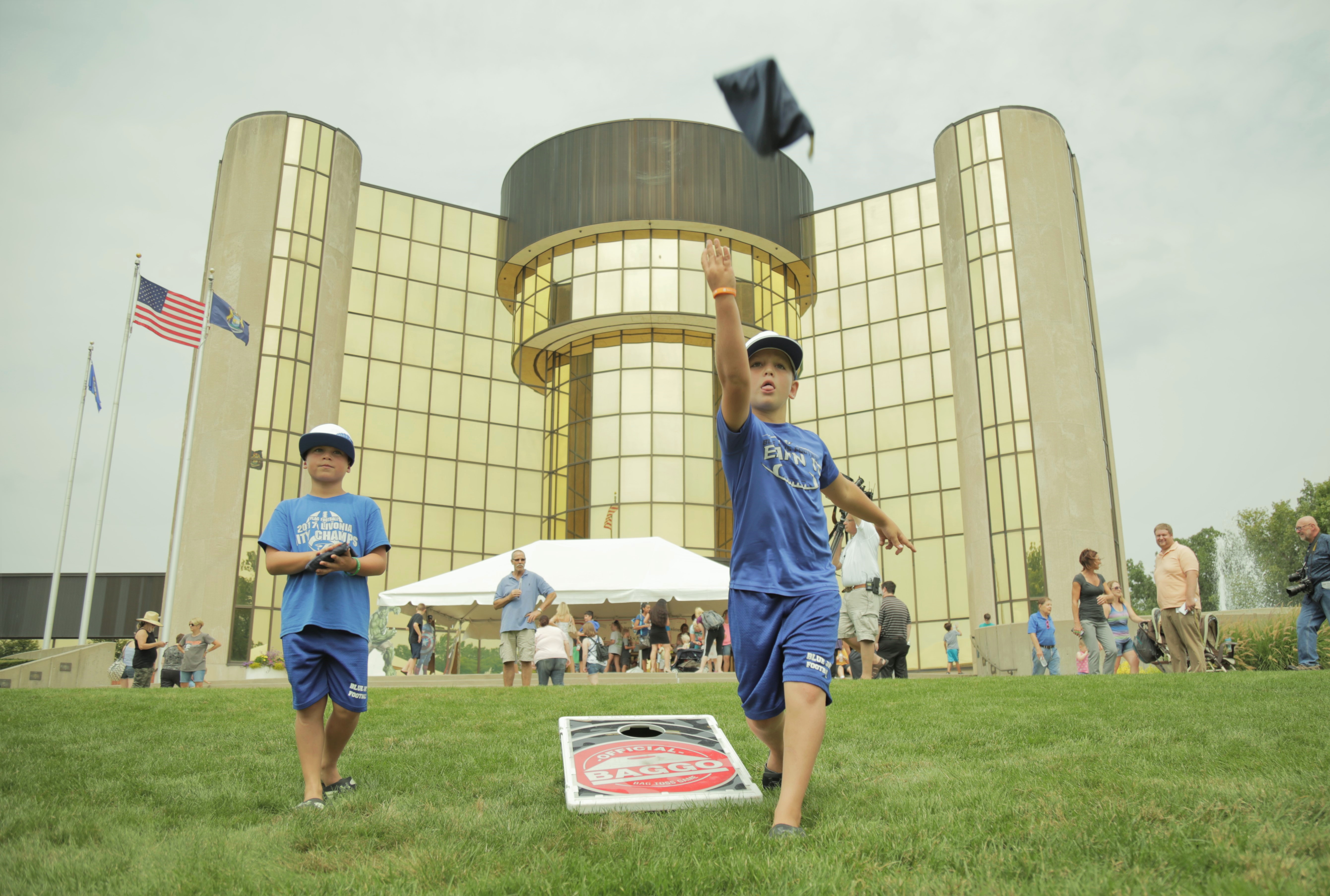 Cornhole players outside City Hall